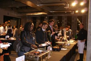 Young professionals sample wild game at a recent Gourmet Gone Wild event. COURTESY: Michigan United Conservation Clubs